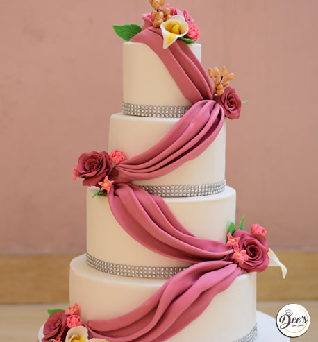 Drapes And Flowers Wedding Cake